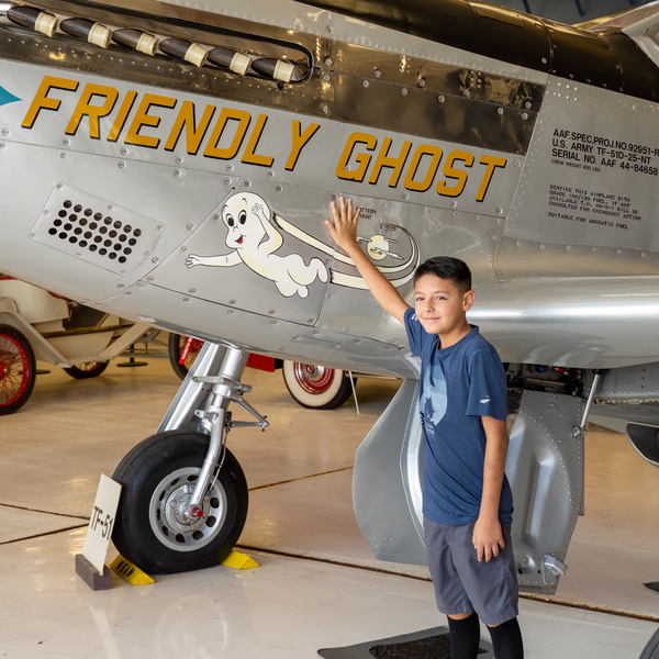 A student getting an up close & personal look at the War Eagles' TF-51. 